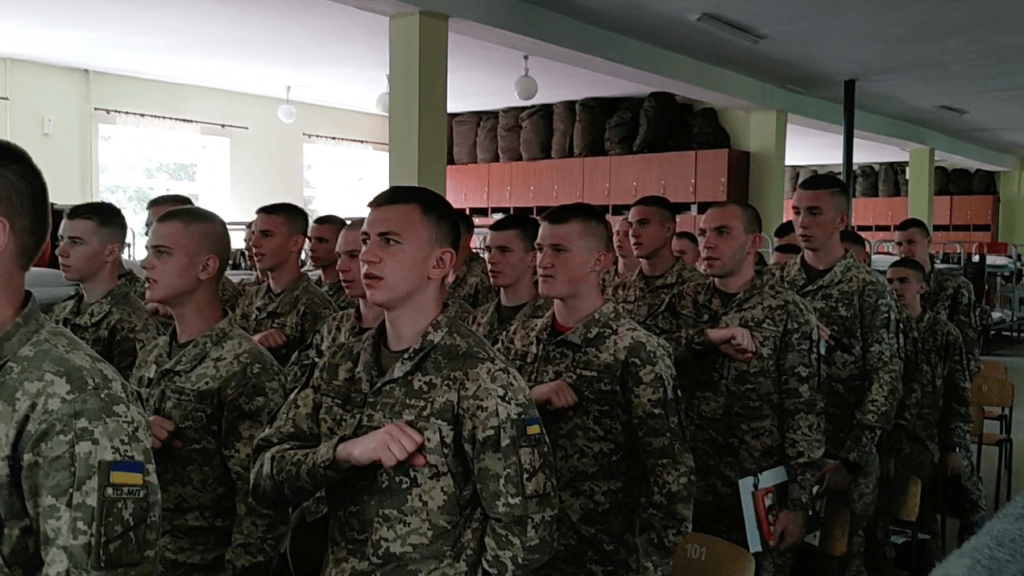 13 A still from the video posted to Centuria’s Telegram shows NAA cadets, led by members of Centuria, reciting the “Prayer of the Ukrainian Nationalist.”